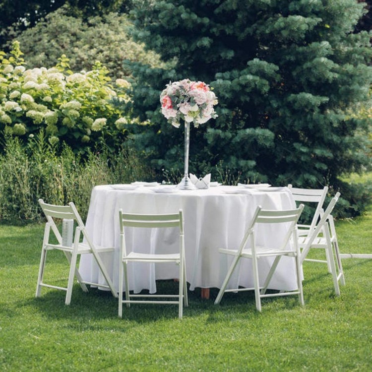 Round table covered with a 90-inch white polyester tablecloth, ideal for weddings and outdoor events.